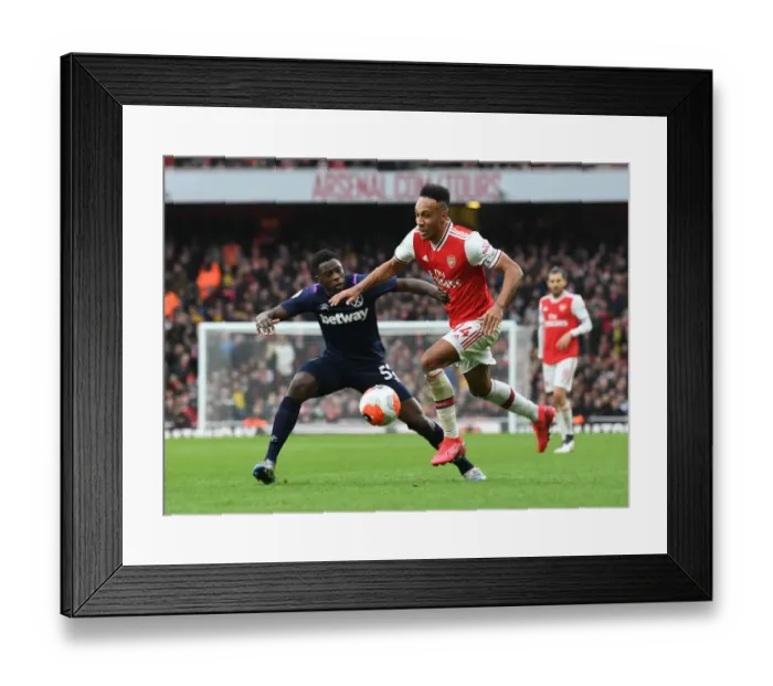 Framed Print : Arsenal's Aubameyang Faces Off Against West Ham's Nhakia in Premier League Clash Framed Print : Arsenal's Aubameyang Faces Off Against West Ham's Nhakia in Premier League Clash
