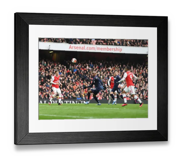 Framed Print : Arsenal's Ozil-Lacazette Duo Scores Dramatic Win Against West Ham United in Premier League Framed Print : Arsenal's Ozil-Lacazette Duo Scores Dramatic Win Against West Ham United in Premier League