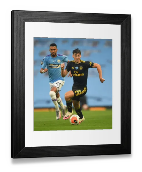 Framed Print : Arsenal's Kieran Tierney Faces Off Against Manchester City in Premier League Showdown, 2019-2020