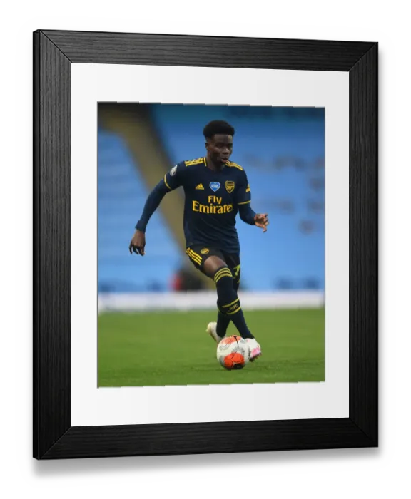 Framed Print : Bukayo Saka's Standout Performance: Manchester City vs. Arsenal, Premier League 2019-2020 - The Young Gun's Game at Etihad Stadium Framed Print : Bukayo Saka's Standout Performance: Manchester City vs. Arsenal, Premier League 2019-2020 - The Young Gun's Game at Etihad Stadium