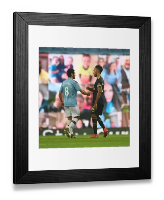 Framed Print : Manchester Rivalry: Aubameyang and Gundogan Embrace After Thrilling Manchester City vs. Arsenal Clash (Premier League 2019-20)