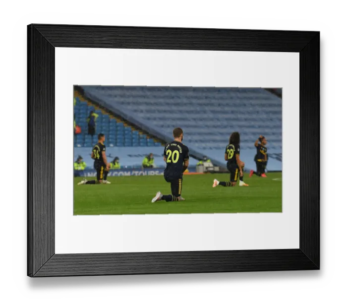 Framed Print : Arsenal's Mustafi Kneels in Solidarity: Manchester City vs. Arsenal, Premier League 2019-20 Framed Print : Arsenal's Mustafi Kneels in Solidarity: Manchester City vs. Arsenal, Premier League 2019-20
