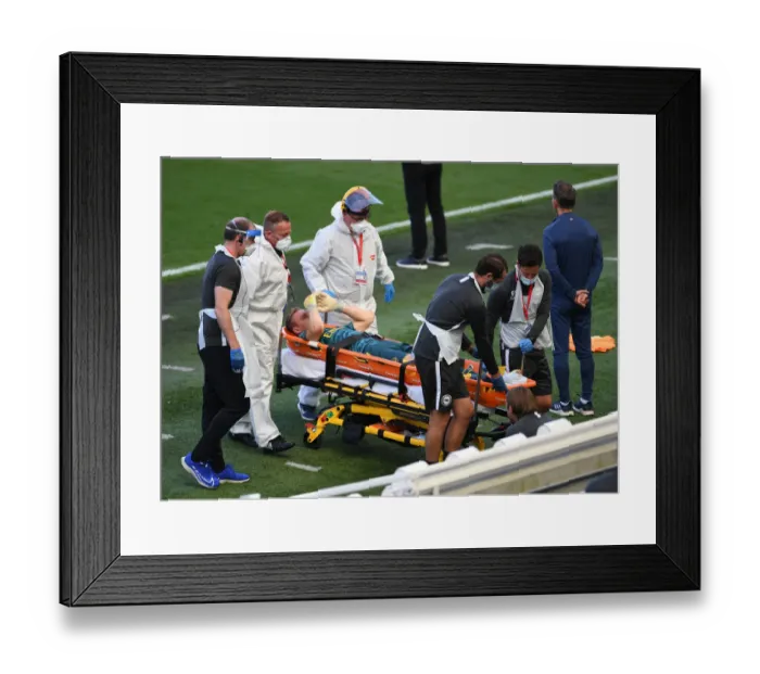 Framed Print : Arsenal's Bernd Leno Suffers Injury in Premier League Match Against Brighton & Hove Albion (2020)