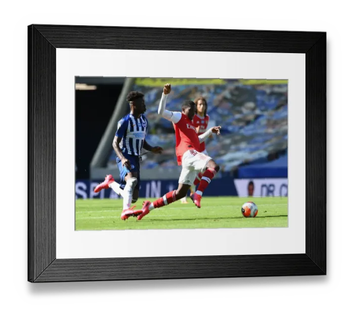 Framed Print : Brighton vs. Arsenal: Nketiah vs. Bissouma Clash in Premier League Showdown