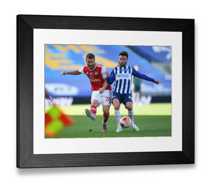 Framed Print : Mustafi Barely Escapes Pressure from Connolly During Arsenal's Tight Battle with Brighton (2020) Framed Print : Mustafi Barely Escapes Pressure from Connolly During Arsenal's Tight Battle with Brighton (2020)