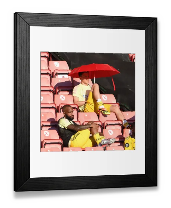 Framed Print : Arsenal's Ozil and Lacazette Seek Shade in Southampton's Summer Showdown (2019-20) Framed Print : Arsenal's Ozil and Lacazette Seek Shade in Southampton's Summer Showdown (2019-20)
