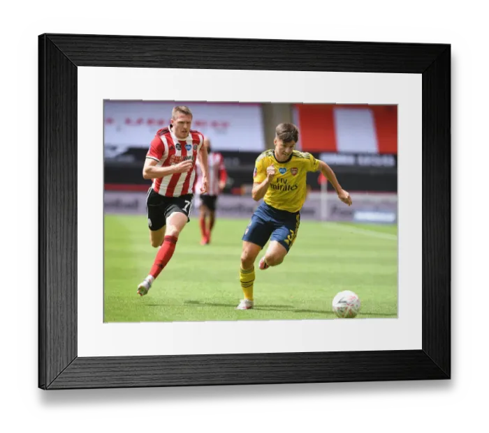 Framed Print : Arsenal's Kieran Tierney Faces Off Against John Lundstram in FA Cup Quarterfinal Clash
