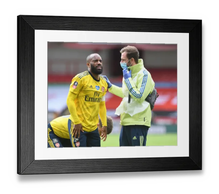 Framed Print : Alexandre Lacazette Receives Treatment: Sheffield United vs. Arsenal, FA Cup Quarterfinal
