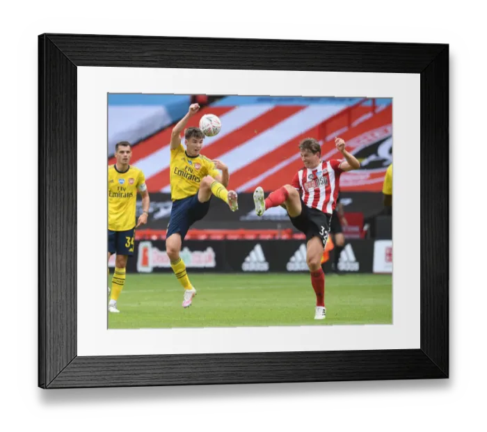 Framed Print : Arsenal's Kieran Tierney Clashes with Sheffield United's Sander Berge in FA Cup Quarterfinal