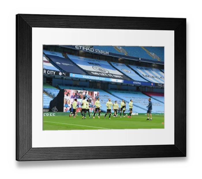 Framed Print : Premier League Showdown: Arsenal vs Manchester City - Warm-Up at Etihad Stadium