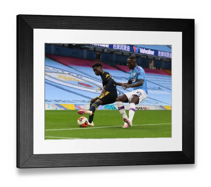 Framed Print : Bukayo Saka Stands Firm Against Benjamin Mendy: Manchester City vs. Arsenal, Premier League 2019-20 Framed Print : Bukayo Saka Stands Firm Against Benjamin Mendy: Manchester City vs. Arsenal, Premier League 2019-20