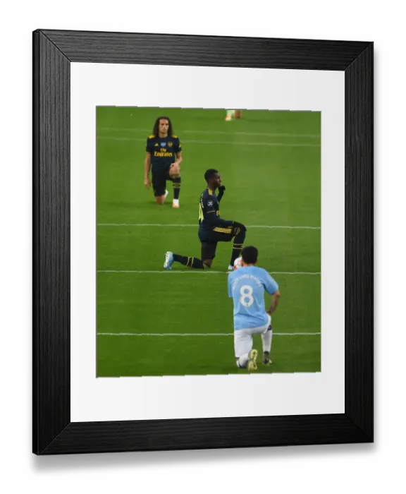 Framed Print : Arsenal's Nketiah Kneels Before Manchester City: Premier League Showdown (2019-20)