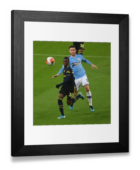 Framed Print : Arsenal's Eddie Nketiah Outmaneuvers Manchester City's Aymeric Laporte in Premier League Clash (Manchester City vs Arsenal 2019-20)