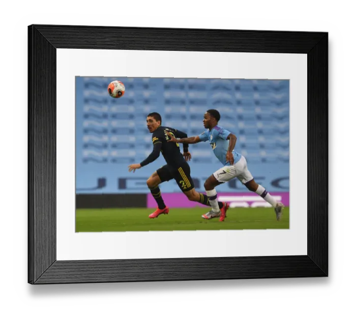 Framed Print : Clash of Stars: Bellerin vs Sterling - Manchester City vs Arsenal FC, Premier League 2019-20: Hector Bellerin vs Raheem Sterling Battle at Etihad Stadium