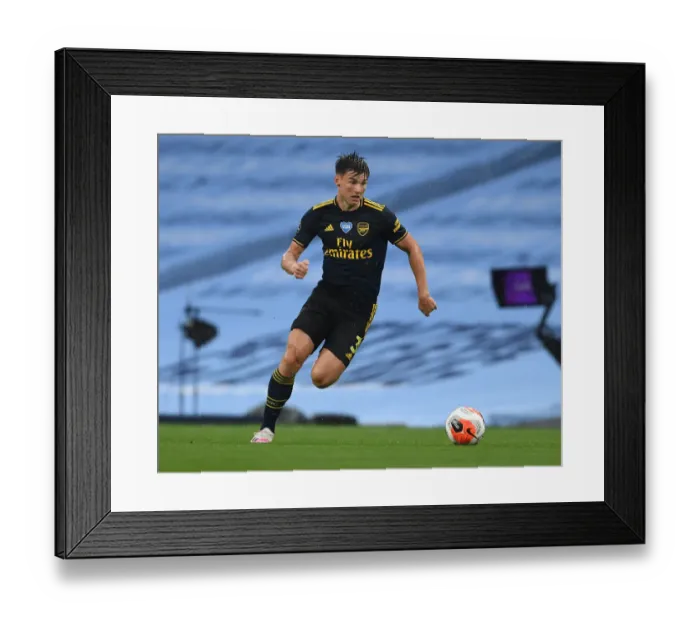 Framed Print : Arsenal's Kieran Tierney Goes Head-to-Head with Manchester City in Premier League Battle, 2019-2020