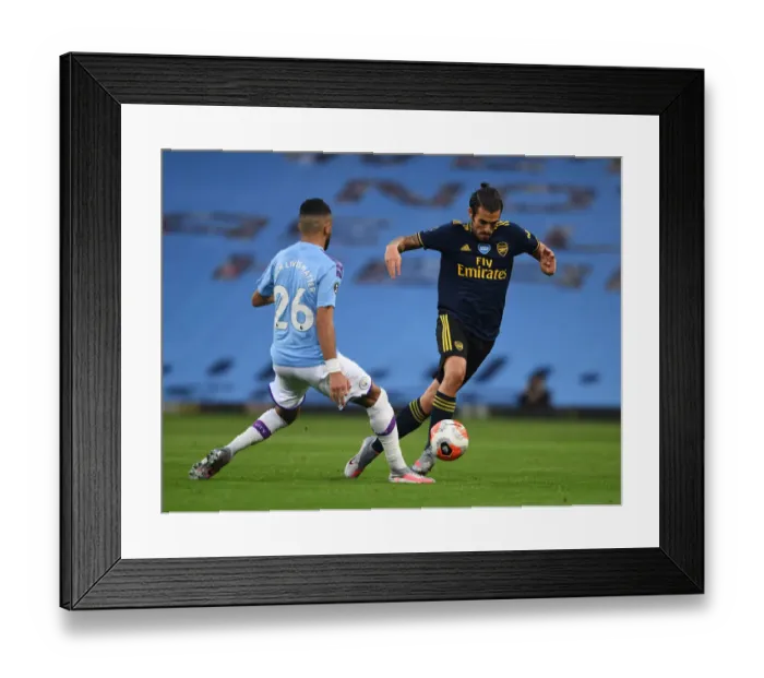 Framed Print : Dani Ceballos vs Riyad Mahrez: Clash of the Stars in Manchester City vs Arsenal FC Premier League Showdown