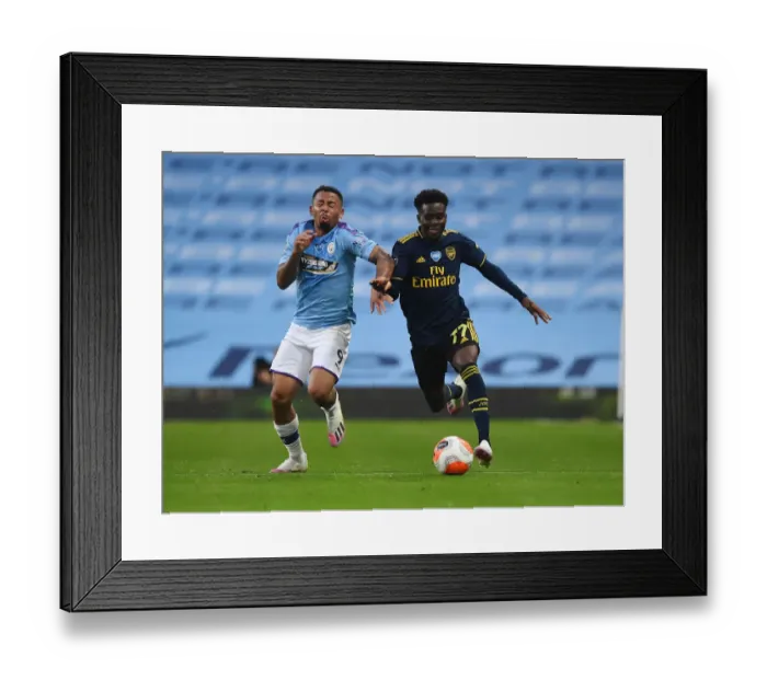 Framed Print : Bukayo Saka vs. Gabriel Jesus: Clash of Premier League Titans - Manchester City vs. Arsenal FC Framed Print : Bukayo Saka vs. Gabriel Jesus: Clash of Premier League Titans - Manchester City vs. Arsenal FC