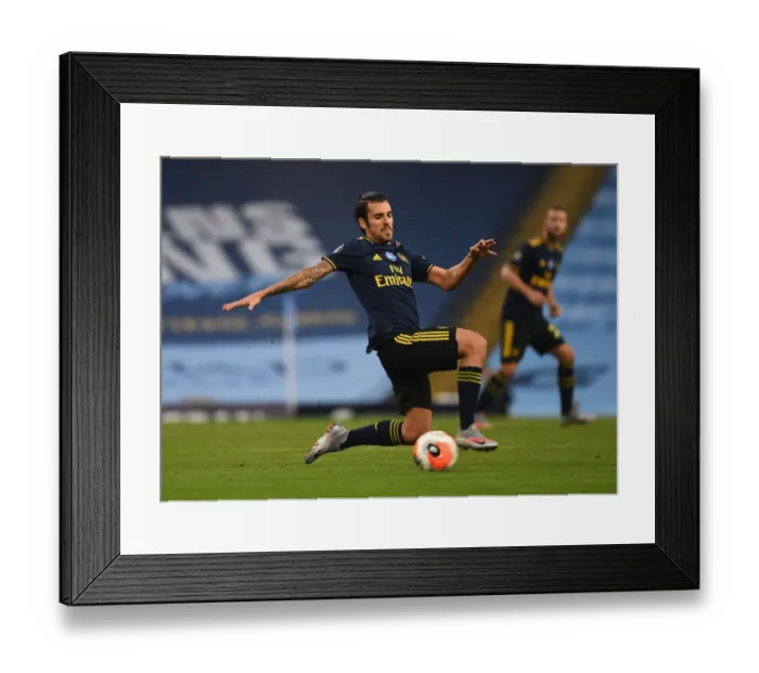 Framed Print : Arsenal's Dani Ceballos Goes Head-to-Head Against Manchester City in Premier League Battle