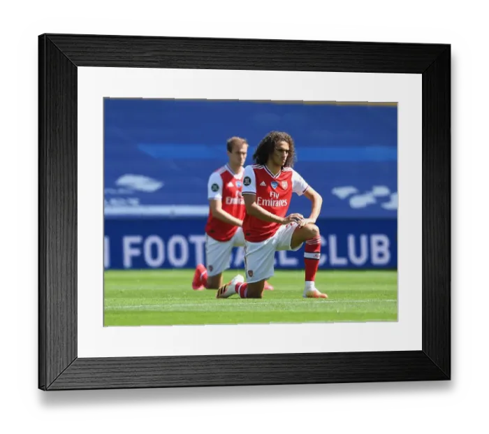 Framed Print : Empty Stands: Matteo Guendouzi Kneels at Brighton & Hove Albion vs Arsenal FC, Premier League 2019-2020