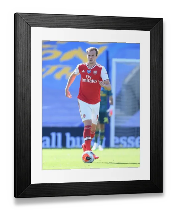 Framed Print : Arsenal's Rob Holding in Empty American Express Community Stadium: Brighton vs. Arsenal, Premier League 2019-2020