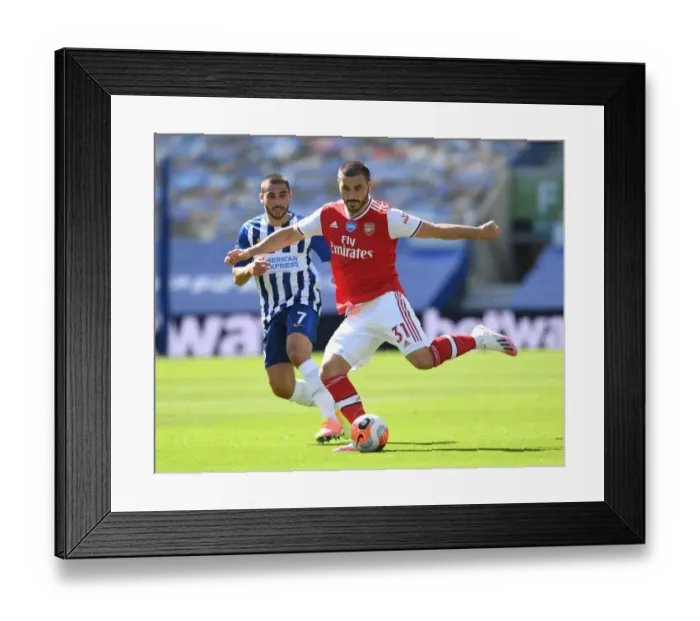 Framed Print : Empty Stands: Sead Kolasinac Breaks Past Neal Maupay in Brighton & Hove Albion vs Arsenal FC (2019-20) Framed Print : Empty Stands: Sead Kolasinac Breaks Past Neal Maupay in Brighton & Hove Albion vs Arsenal FC (2019-20)