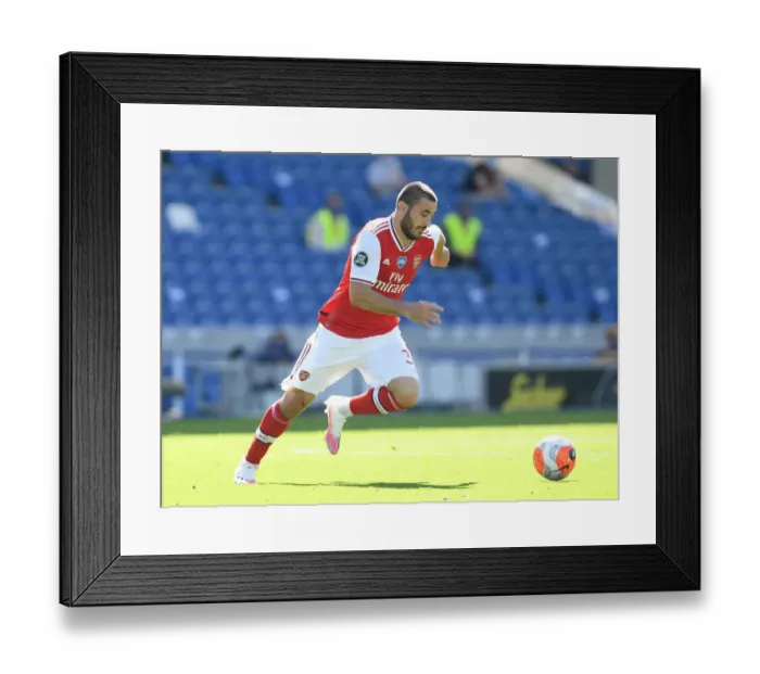 Framed Print : Empty Stands: Sead Kolasinac of Arsenal in Action against Brighton & Hove Albion (2019-2020) Framed Print : Empty Stands: Sead Kolasinac of Arsenal in Action against Brighton & Hove Albion (2019-2020)