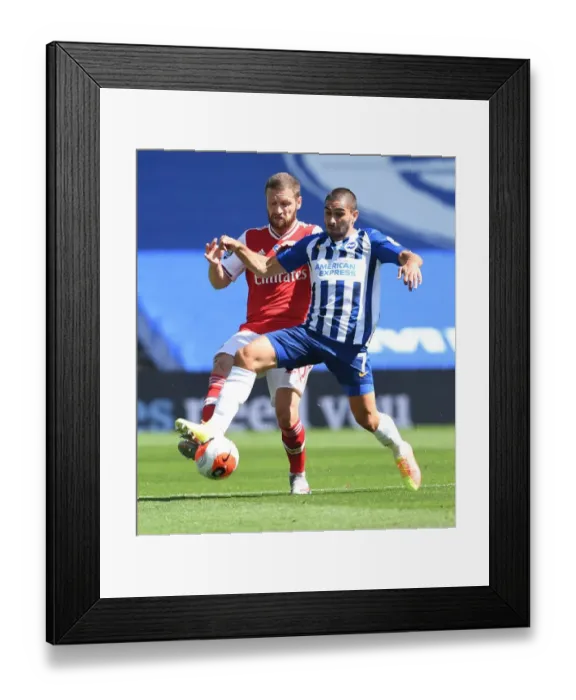 Framed Print : Mustafi vs. Maupay: Empty Stadium Showdown - Brighton vs. Arsenal Premier League Clash
