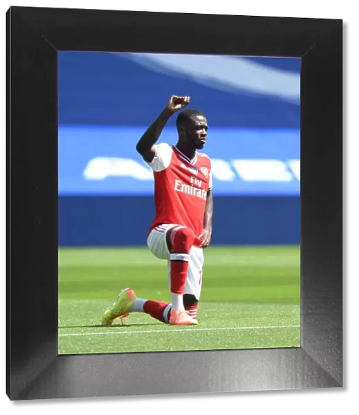 Arsenal's Pepe Kneels at Empty Brighton Stadium - Premier League 2019-2020