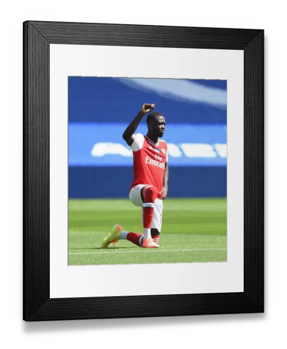 Framed Print : Arsenal's Pepe Kneels at Empty Brighton Stadium - Premier League 2019-2020 Framed Print : Arsenal's Pepe Kneels at Empty Brighton Stadium - Premier League 2019-2020
