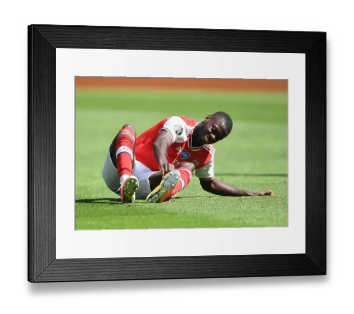 Framed Print : Brighton vs. Arsenal: Pepe Suffers Injury in Empty Premier League Clash (2020) Framed Print : Brighton vs. Arsenal: Pepe Suffers Injury in Empty Premier League Clash (2020)