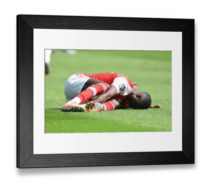 Framed Print : Pepe Suffers Injury in Empty Premier League Clash: Brighton vs. Arsenal (2019-20) Framed Print : Pepe Suffers Injury in Empty Premier League Clash: Brighton vs. Arsenal (2019-20)
