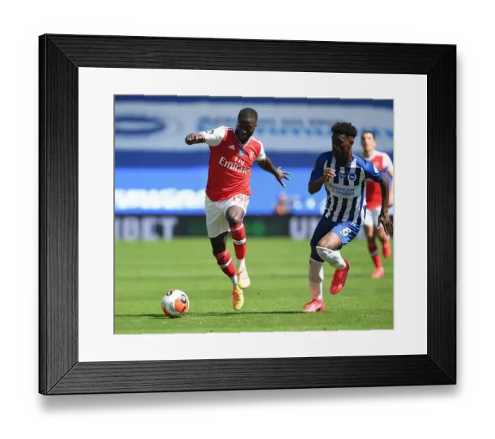 Framed Print : Pepe Breaks Past Bissouma: Empty Stadium Showdown - Brighton vs. Arsenal, Premier League 2019-2020