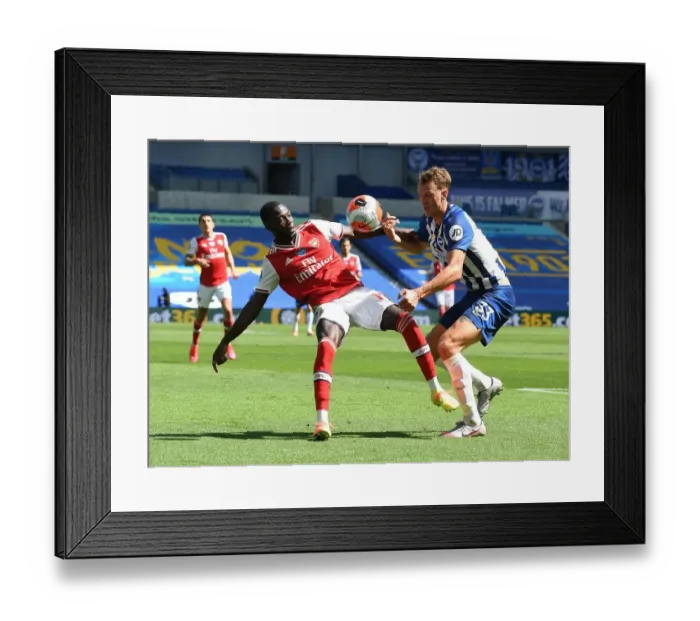 Framed Print : Pepe vs Burn: Empty-stadium Showdown - Brighton & Hove Albion vs Arsenal FC, Premier League 2019-2020 Framed Print : Pepe vs Burn: Empty-stadium Showdown - Brighton & Hove Albion vs Arsenal FC, Premier League 2019-2020
