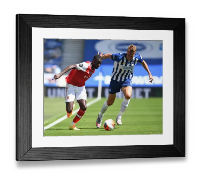 Framed Print : Pepe vs. Burn: A Deserted Battle – Arsenal vs. Brighton in Empty Premier League Stadiums (2019-20)