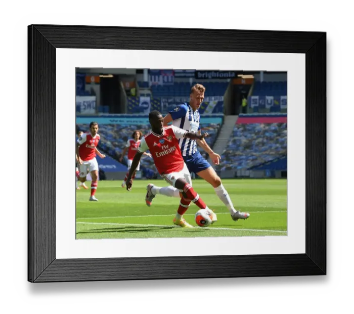 Framed Print : Pepe vs Burn: Empty Stadium Showdown - Brighton & Hove Albion vs Arsenal FC, Premier League 2019-2020 Framed Print : Pepe vs Burn: Empty Stadium Showdown - Brighton & Hove Albion vs Arsenal FC, Premier League 2019-2020