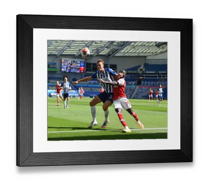 Framed Print : Pepe vs. Burn: Empty Stadium Showdown - Premier League Battle in Brighton (2019-20) Framed Print : Pepe vs. Burn: Empty Stadium Showdown - Premier League Battle in Brighton (2019-20)