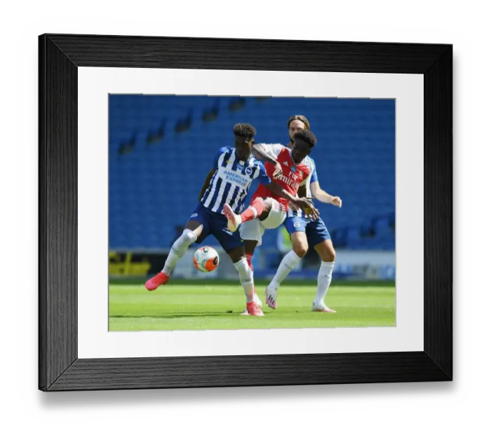 Framed Print : Bukayo Saka vs. Yves Bissouma: A Battle in the Empty Arsenal Stadium Framed Print : Bukayo Saka vs. Yves Bissouma: A Battle in the Empty Arsenal Stadium