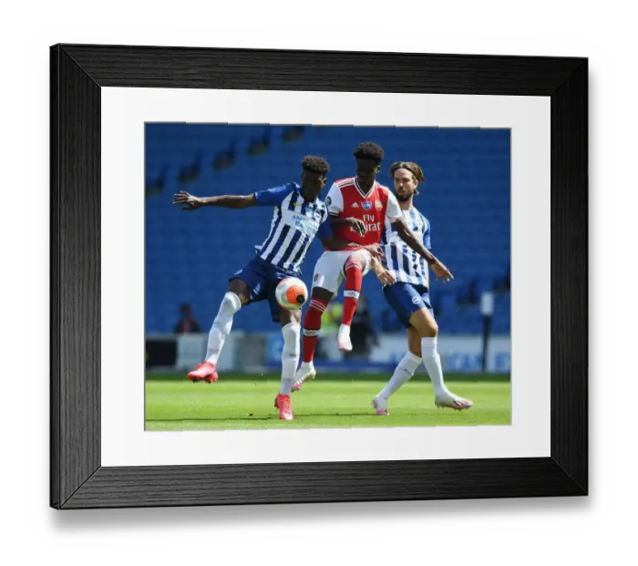 Framed Print : Empty Stadium Showdown: Bukayo Saka vs. Yves Bissouma - A Premier League Battle in Deserted Brighton Stadium Framed Print : Empty Stadium Showdown: Bukayo Saka vs. Yves Bissouma - A Premier League Battle in Deserted Brighton Stadium