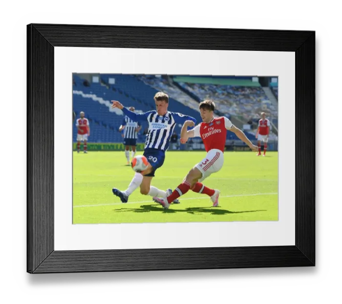 Framed Print : Brighton vs Arsenal: Empty Stadium Showdown - Kieran Tierney Clashes with Solly March (Premier League, 2020)