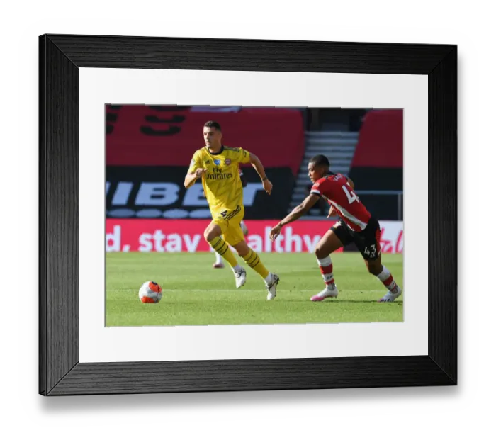 Framed Print : Granit Xhaka Overpowers Yan Valery: Arsenal's Victory Moment at Southampton, Premier League 2019-2020 Framed Print : Granit Xhaka Overpowers Yan Valery: Arsenal's Victory Moment at Southampton, Premier League 2019-2020