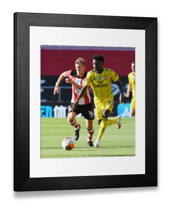 Framed Print : Saka vs Ward-Prowse: Intense Battle in Southampton vs Arsenal Premier League Clash Framed Print : Saka vs Ward-Prowse: Intense Battle in Southampton vs Arsenal Premier League Clash