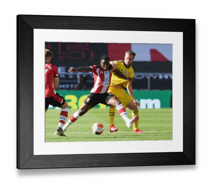 Framed Print : Rivalry Renewed: Holding vs Obafemi Clash in Southampton vs Arsenal Premier League Showdown