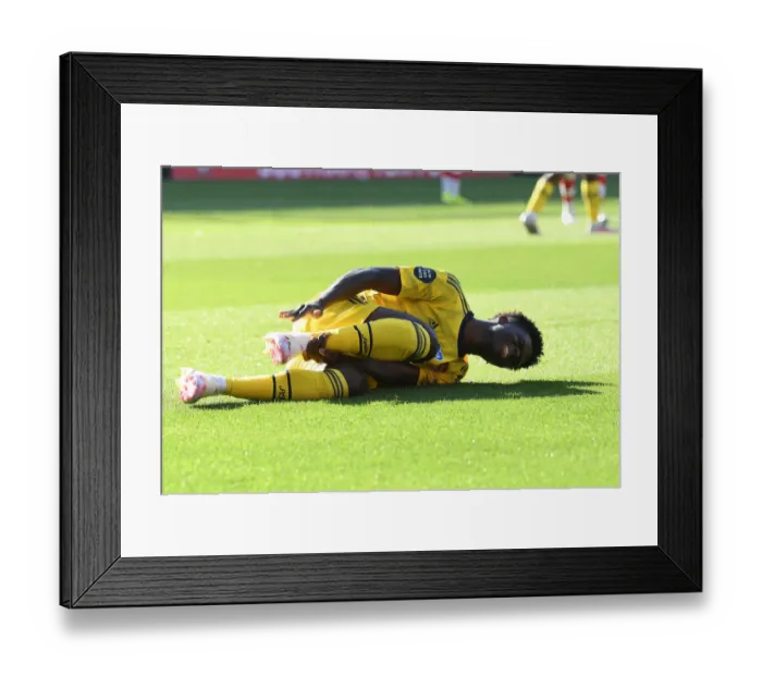 Framed Print : Bukayo Saka Suffers Injury in Arsenal's Southampton Clash (2019-20)