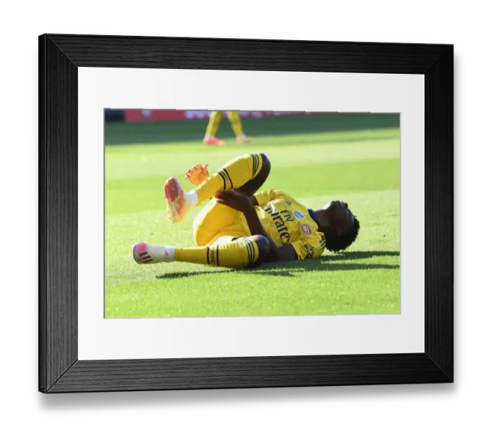 Framed Print : Bukayo Saka Suffers Injury in Southampton vs. Arsenal Clash (2019-20)
