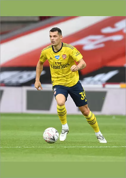 Granit Xhaka in Action: Arsenal's FA Cup Battle against Sheffield United