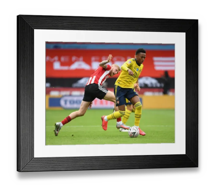 Framed Print : Joe Willock's Brilliant Outmaneuver of Olivier McBurnie: Arsenal's FA Cup Quarterfinal Victory