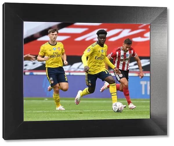 Bukayo Saka in Action: Arsenal's FA Cup Battle against Sheffield United