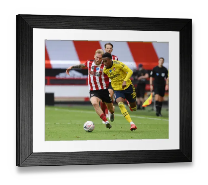 Framed Print : Arsenal's Joe Willock Powers Past Sheffield United's Olivier McBurnie in FA Cup Quarterfinal Showdown Framed Print : Arsenal's Joe Willock Powers Past Sheffield United's Olivier McBurnie in FA Cup Quarterfinal Showdown