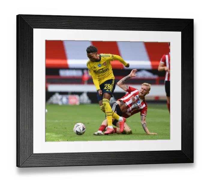 Framed Print : Joe Willock's Slick Moves: Outsmarting Olivier McBurnie in Arsenal's FA Cup Quarterfinal Victory Framed Print : Joe Willock's Slick Moves: Outsmarting Olivier McBurnie in Arsenal's FA Cup Quarterfinal Victory