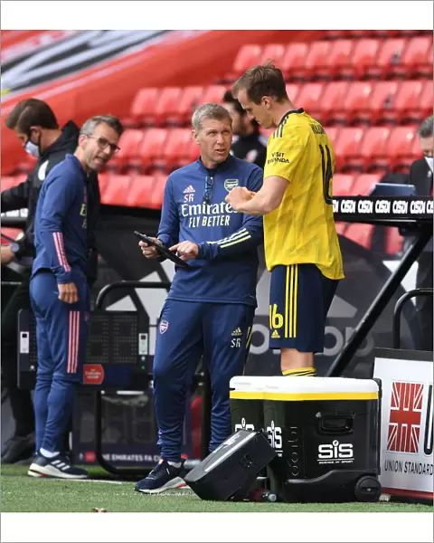 Arsenal's Assistant Coach Steve Round Speaks to Rob Holding during FA Cup Quarterfinal vs Sheffield United